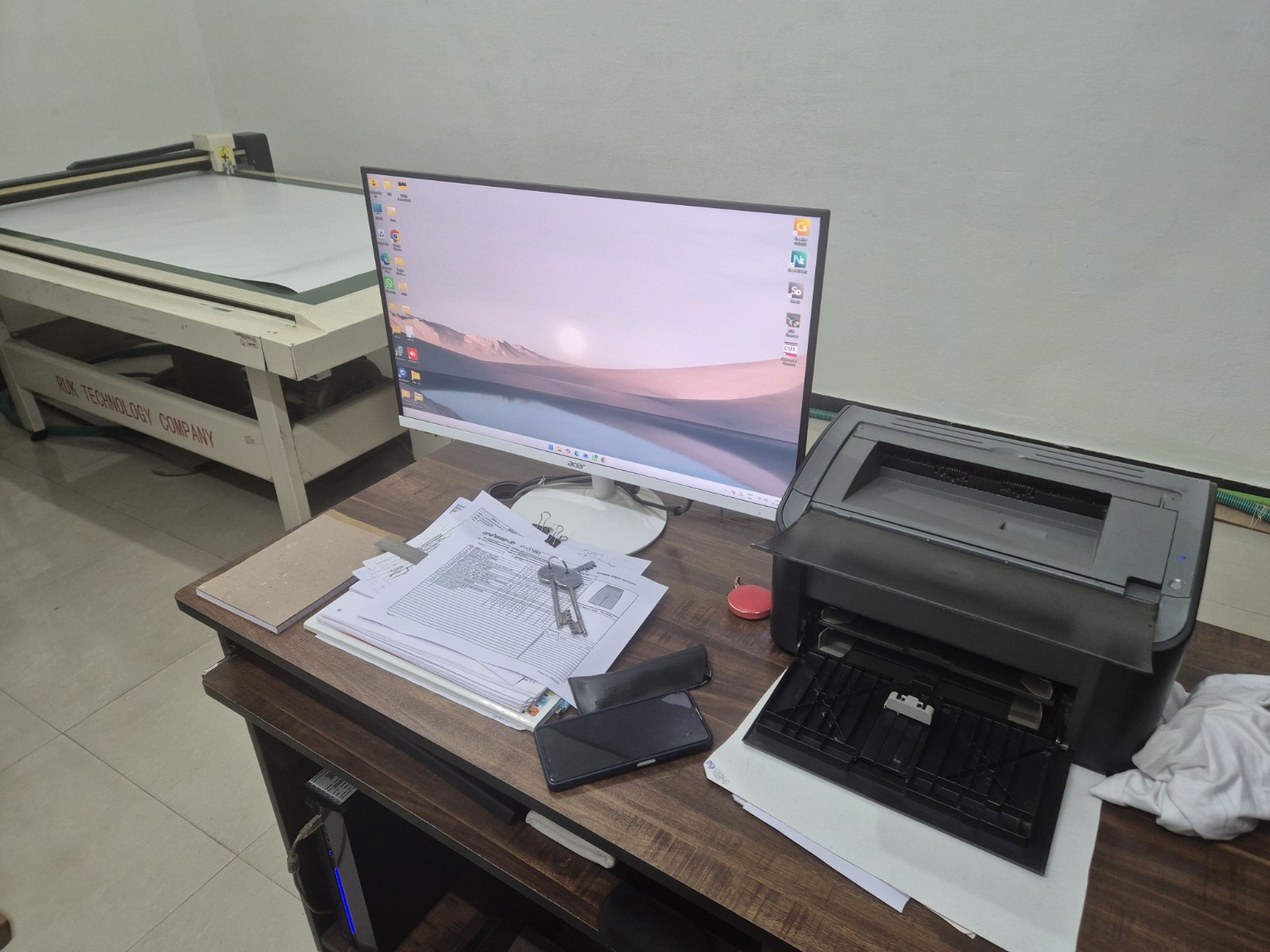 Aram Pattern Center workspace with computerized cutting equipment